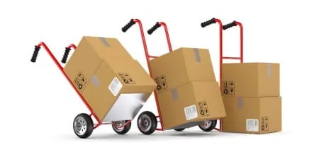 Hand truck loaded with labeled moving boxes for an office move